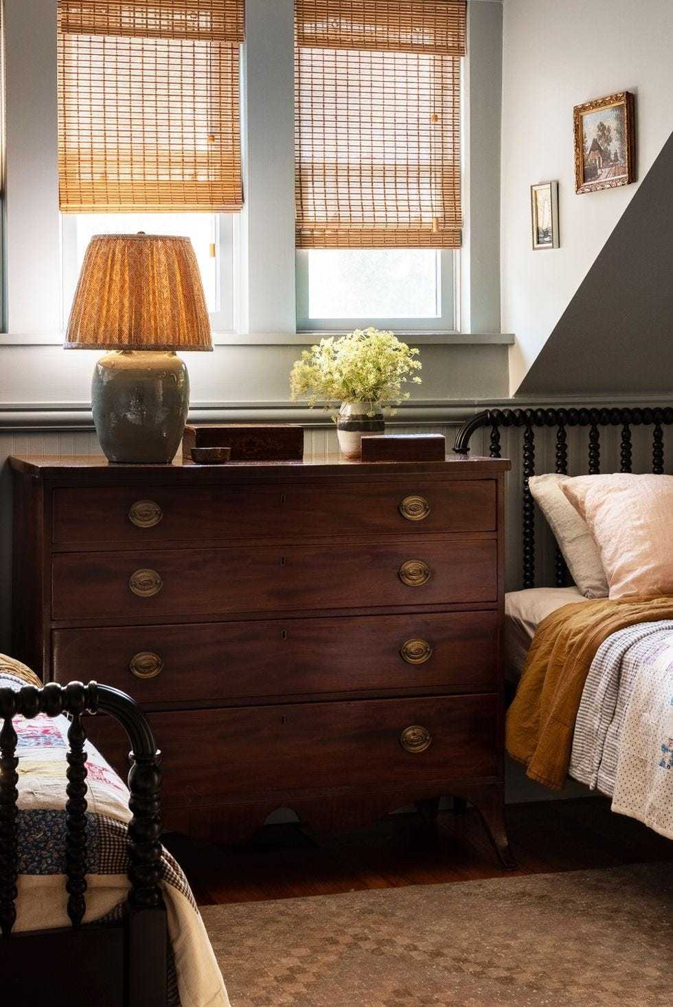A source bedroom places a shared dresser between two beds, illustrating storage within an existing bedside position.