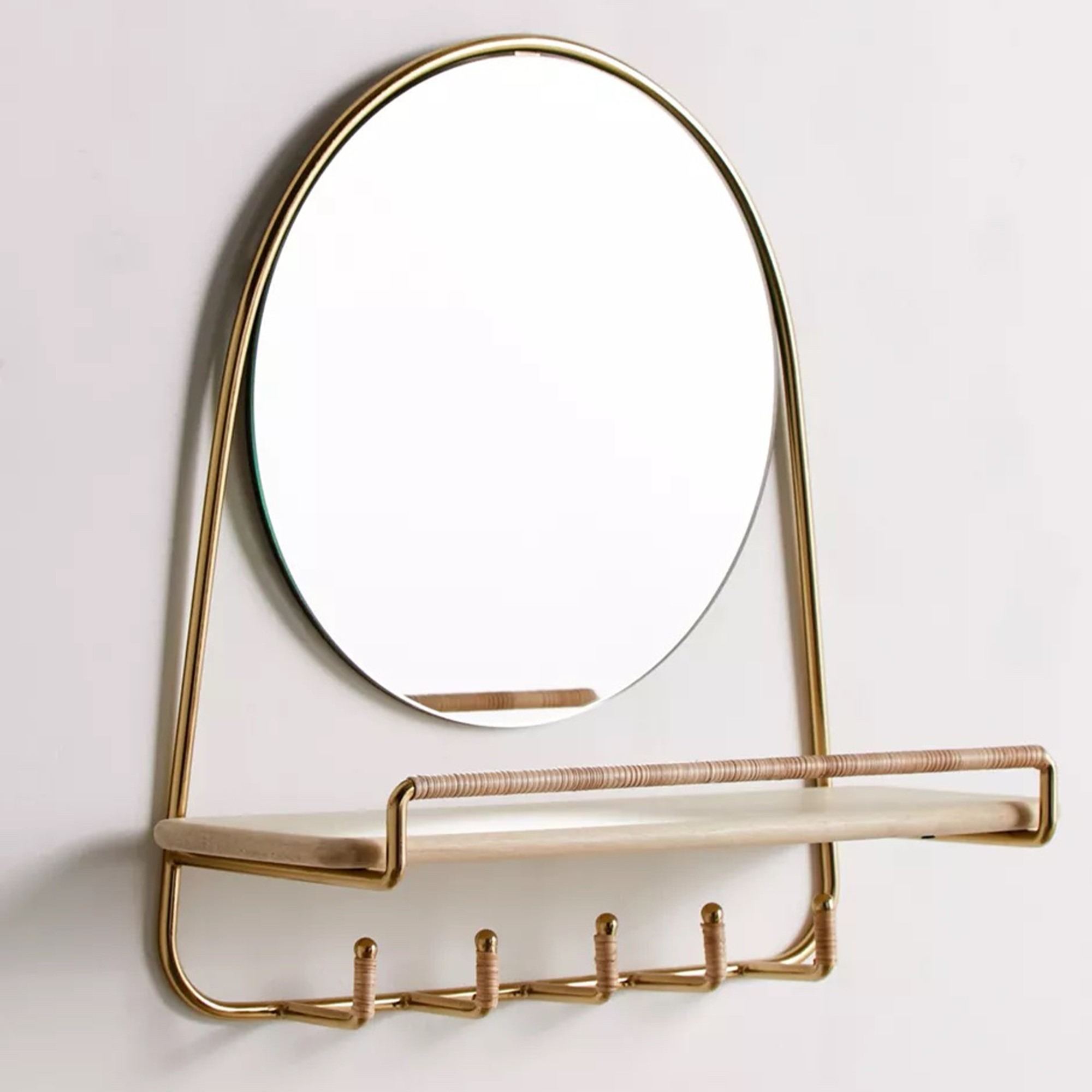 A separate mirror, shelf, and hook combination in the source illustrates one compact arrangement for departure essentials.