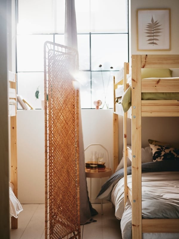 The shared-home example uses a woven divider between bunk-bed areas, illustrating visual separation within a shared bedroom.