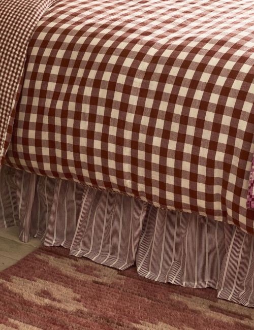 The reference shopping edit shows a striped bed skirt below checked bedding, illustrating a different pattern relationship from the cover.