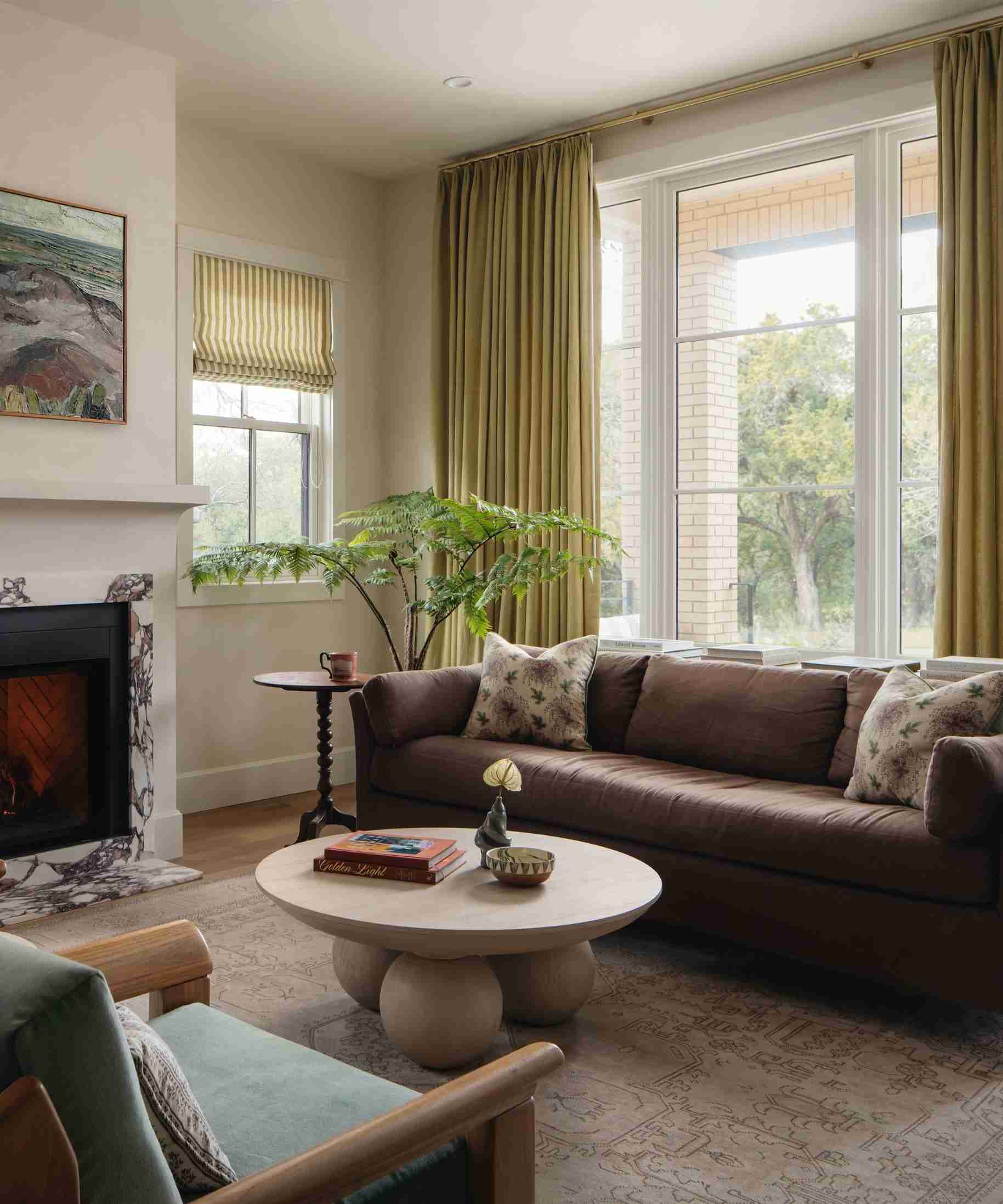 A separate source living room uses long colored curtains against light walls, illustrating color introduced through a textile layer.