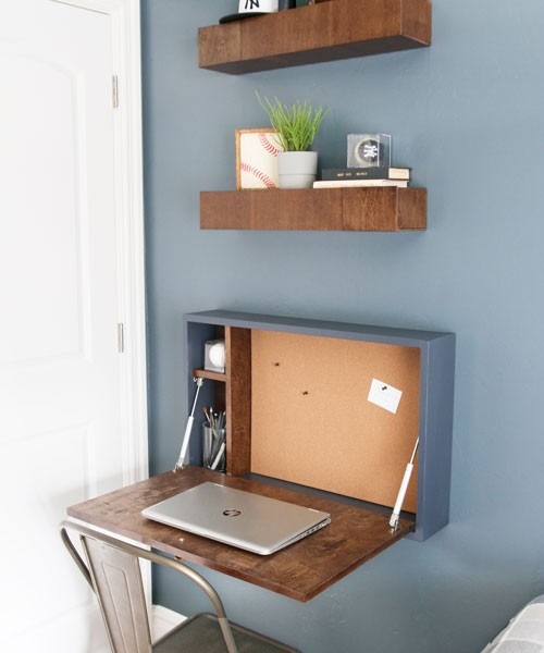 The source fold-down desk is pictured open with a laptop, illustrating why both working and closed positions need consideration.