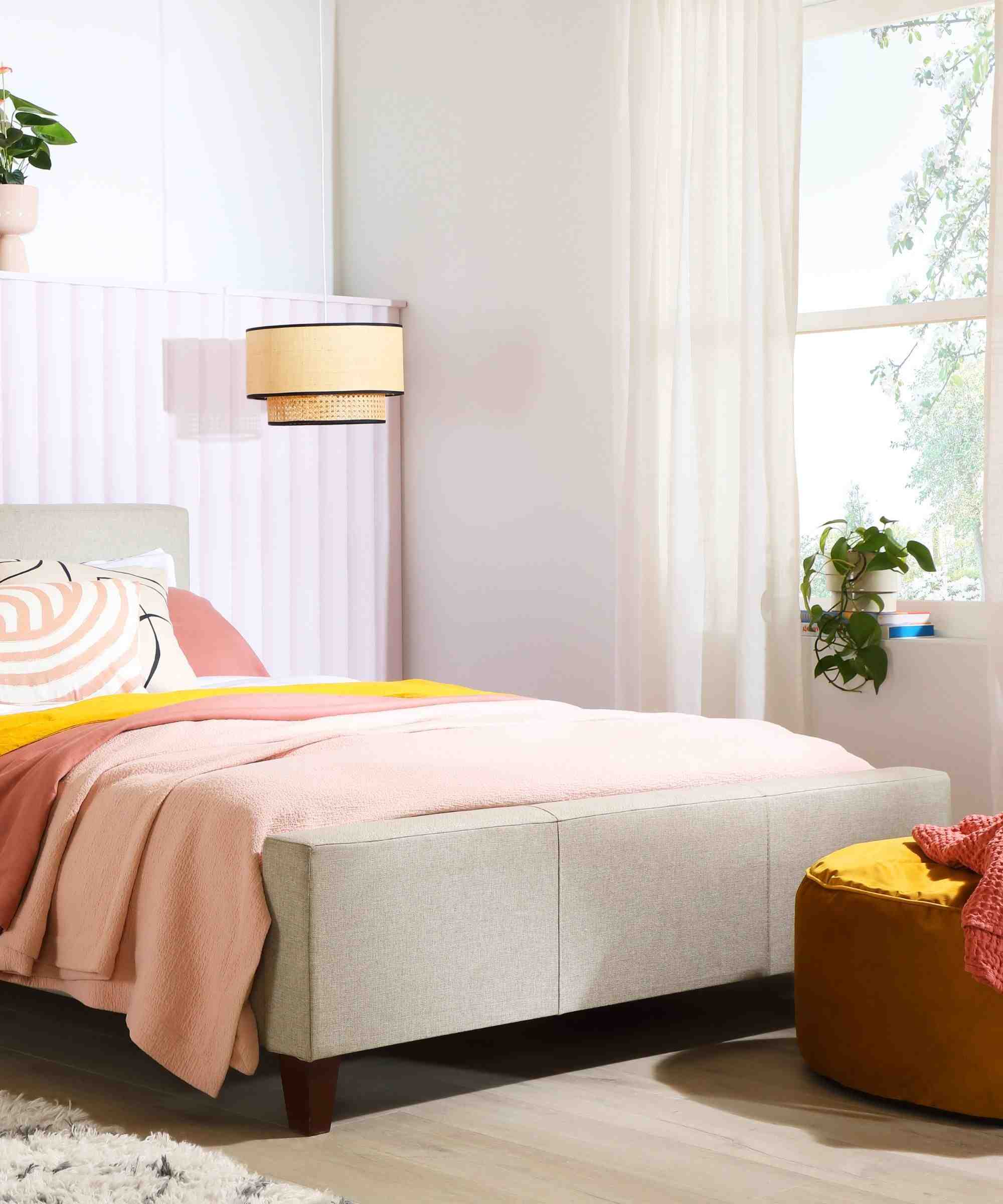 A separate source bedroom combines a light window covering, pink bedding, and an upholstered bench at the foot of the bed.