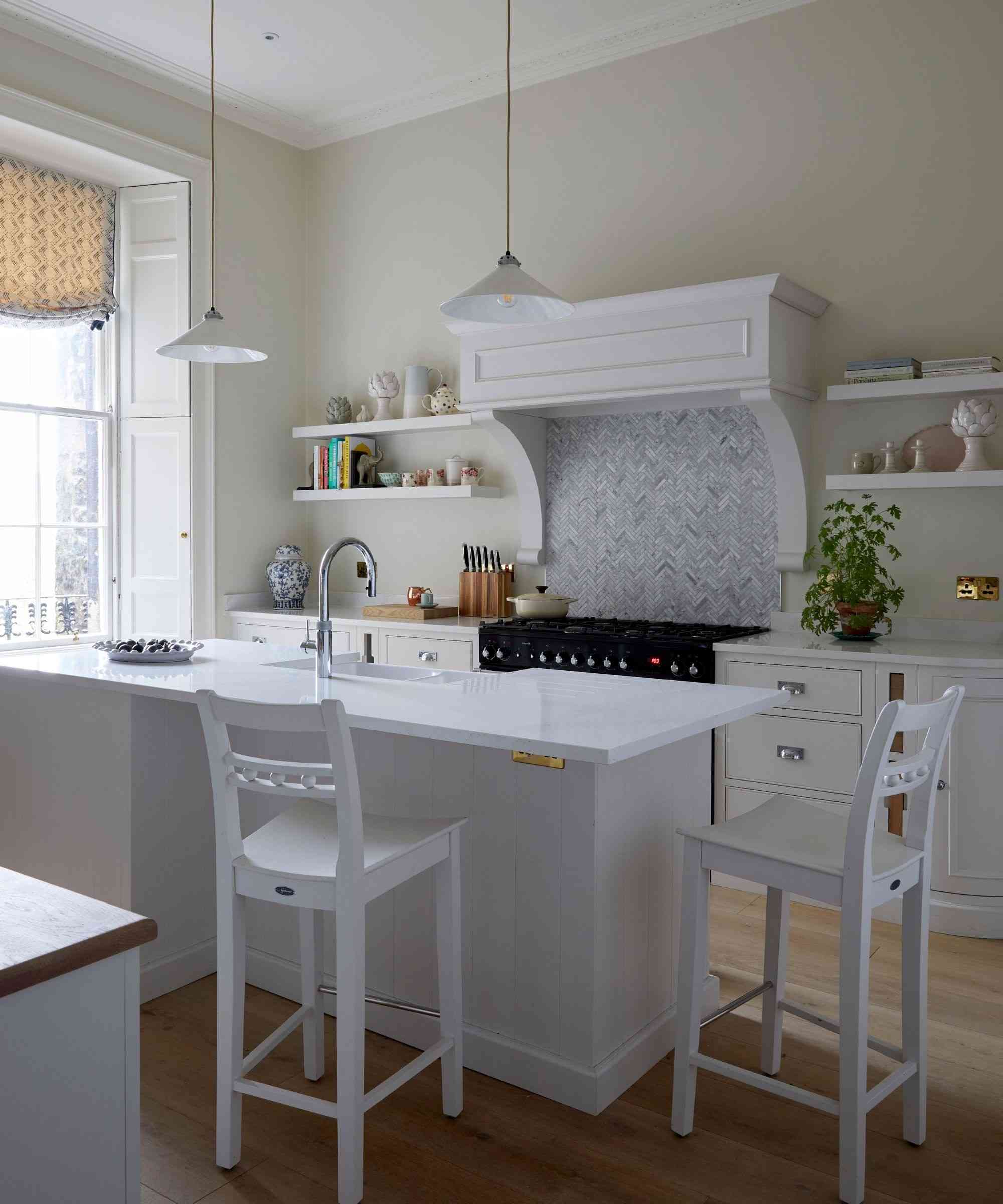 Another illustrative source kitchen places small plants near its working surfaces while leaving preparation areas visible; it is not a before-and-after view of the author's home.