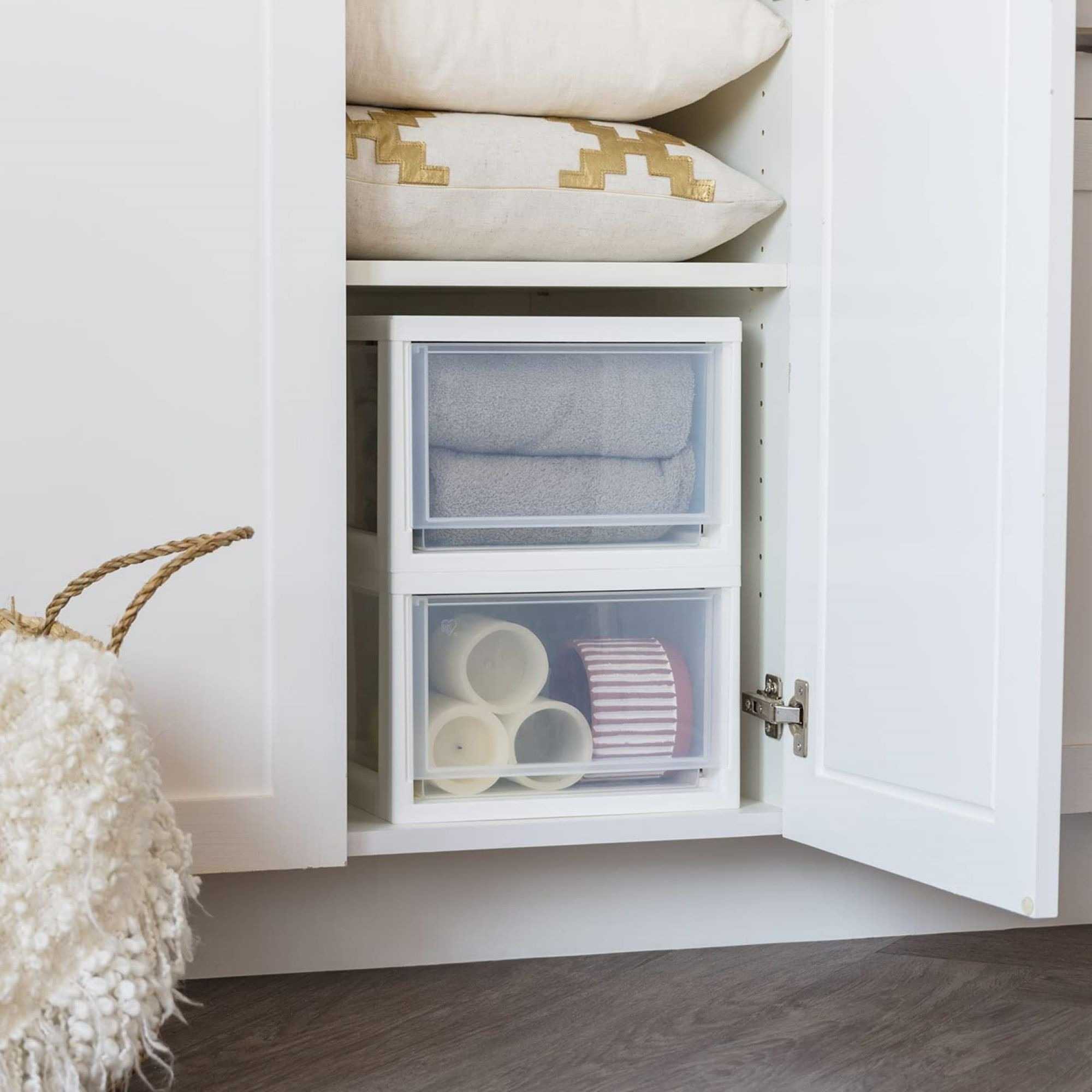 The source shopping example stacks translucent drawers inside a cabinet to contain textiles and small accessories.