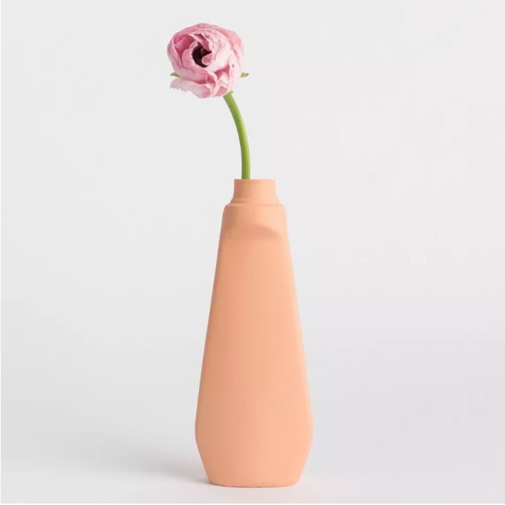 An orange ceramic vase in the source shopping edit illustrates the smaller scale of a color accent compared with a fully painted surface.