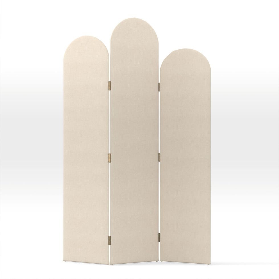 The Tiered Cecilia Screen in the House Beautiful shopping edit illustrates an opaque folding panel with rounded upper edges.