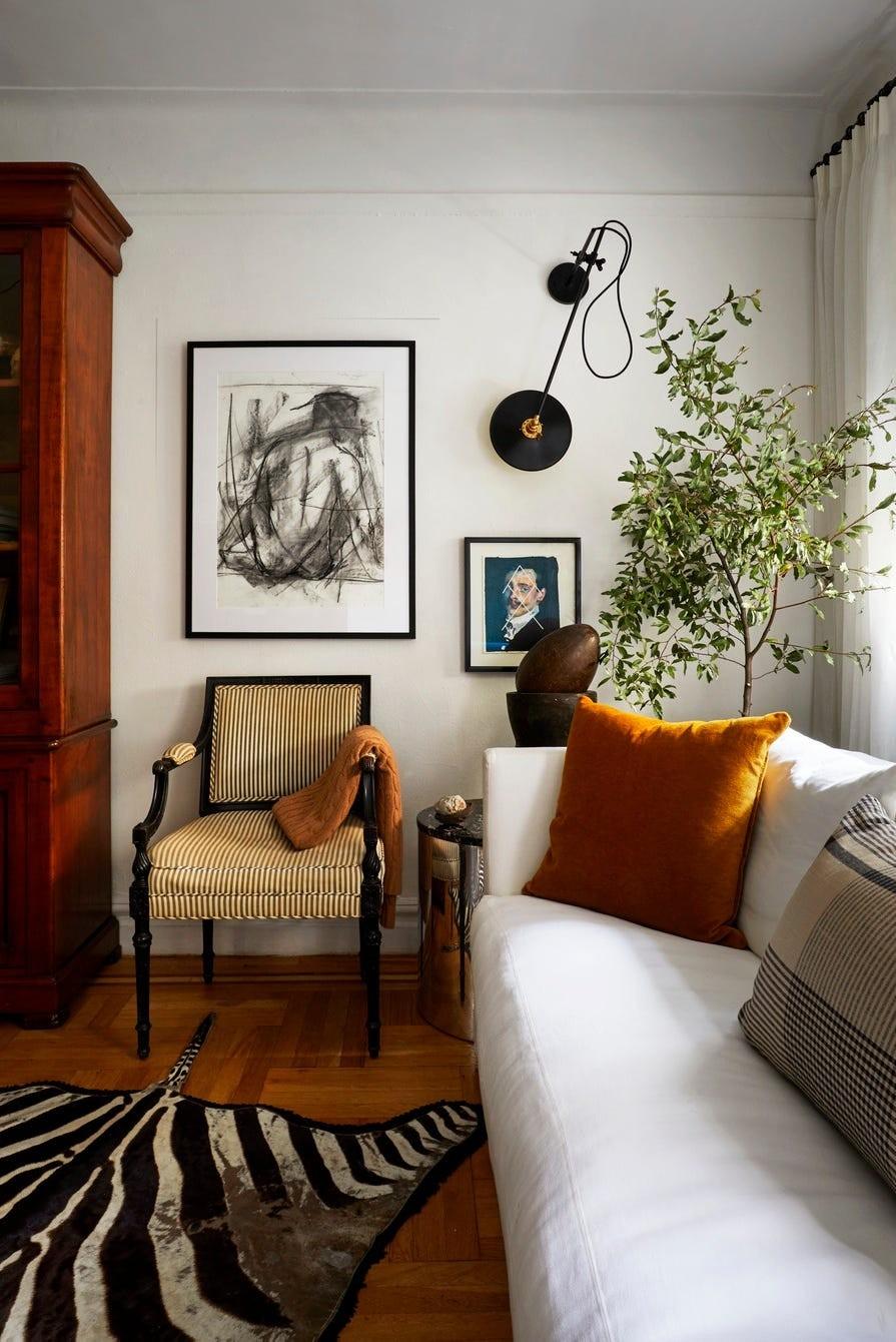 David Frazier's source example places a distinctive armchair beside a restrained sofa.