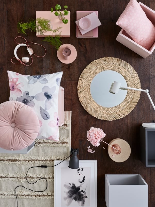 The source mood-board view groups floral textiles, pink accessories, storage boxes, a woven mirror, and a rug as a coordinated palette.