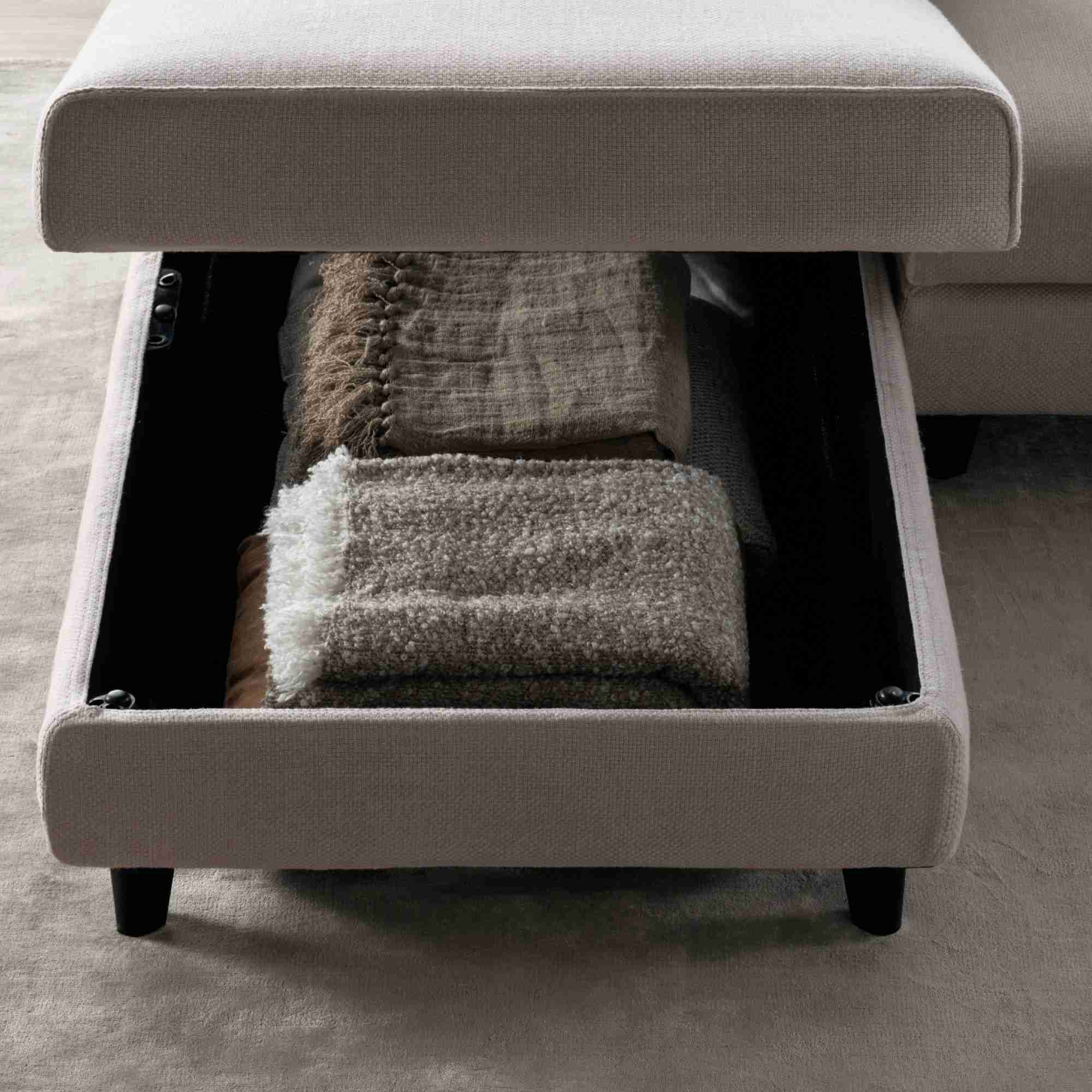 A source detail view shows internal storage beneath a lifted upholstered section.