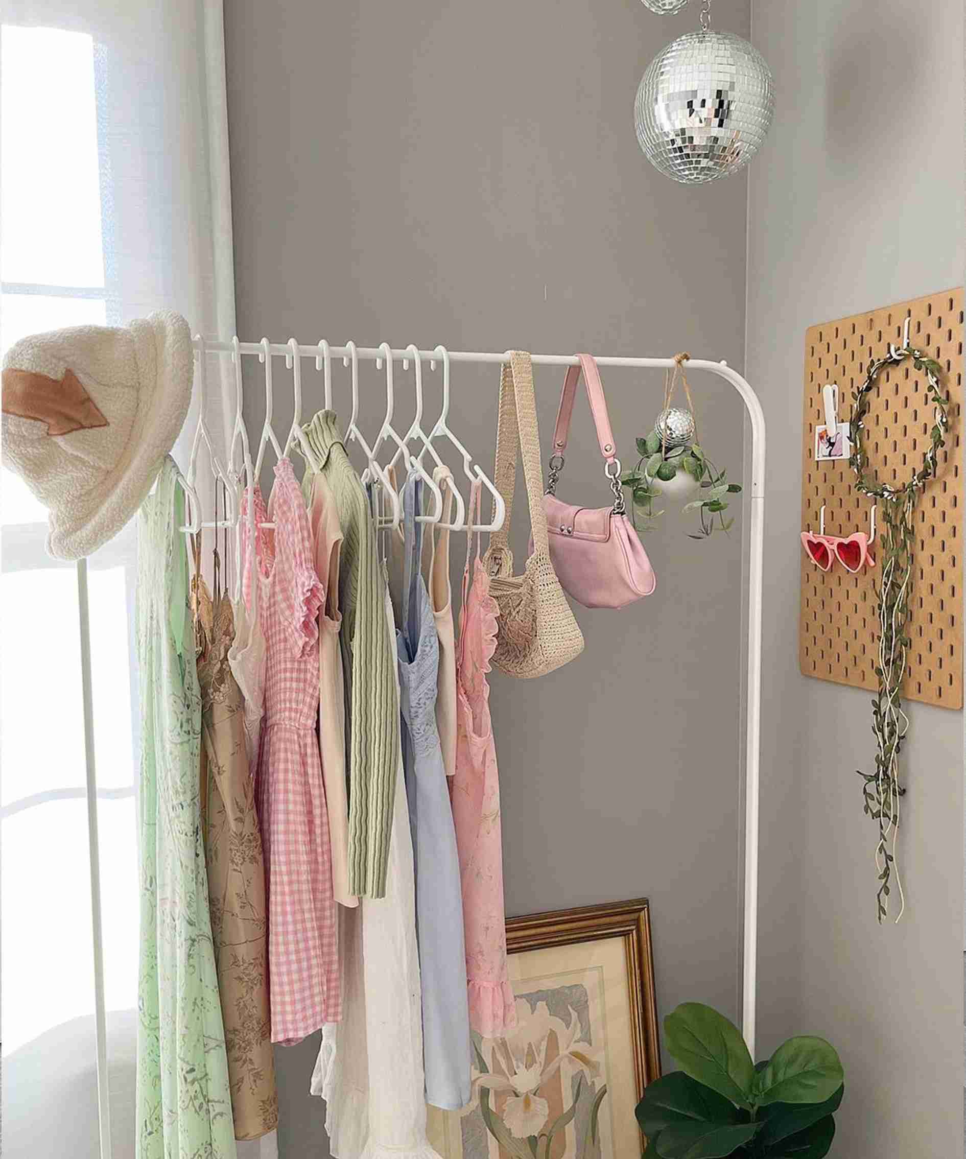 A separate source garment rack combines hanging clothes with small accessories, illustrating another possible storage location in the wider roundup.