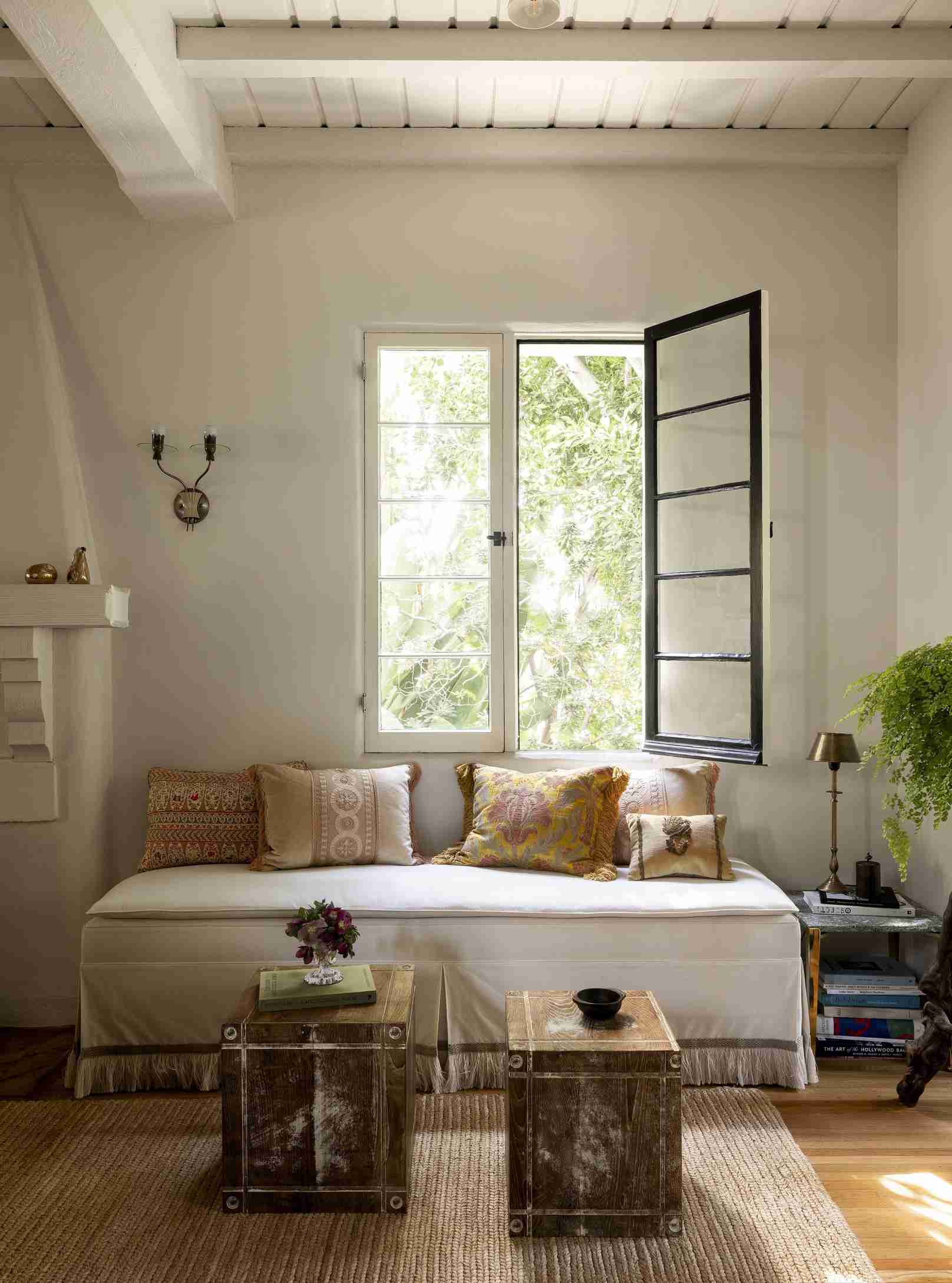 The Los Feliz project uses a backless perimeter seat beside an open window.